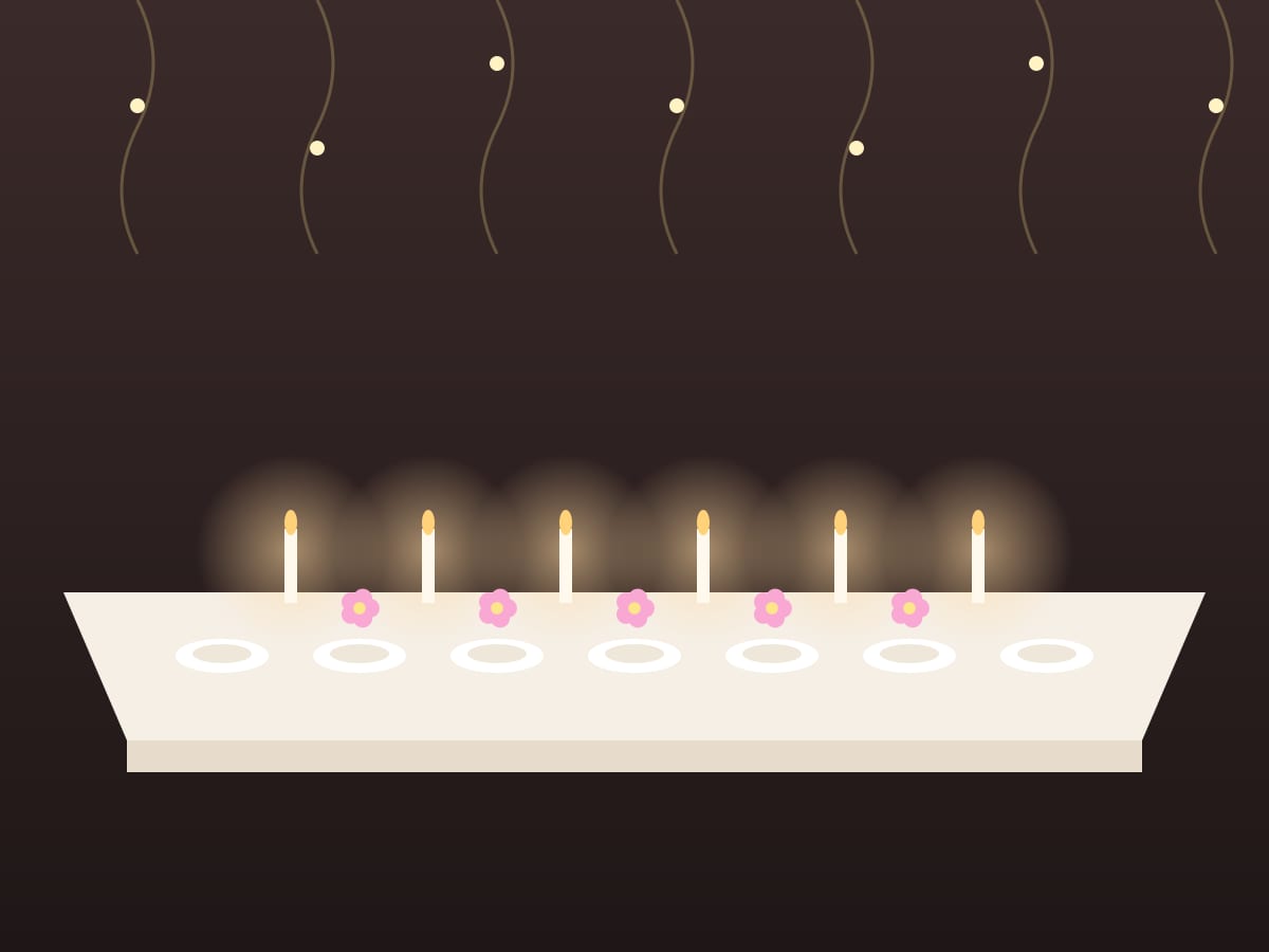 A long dinner table with candles