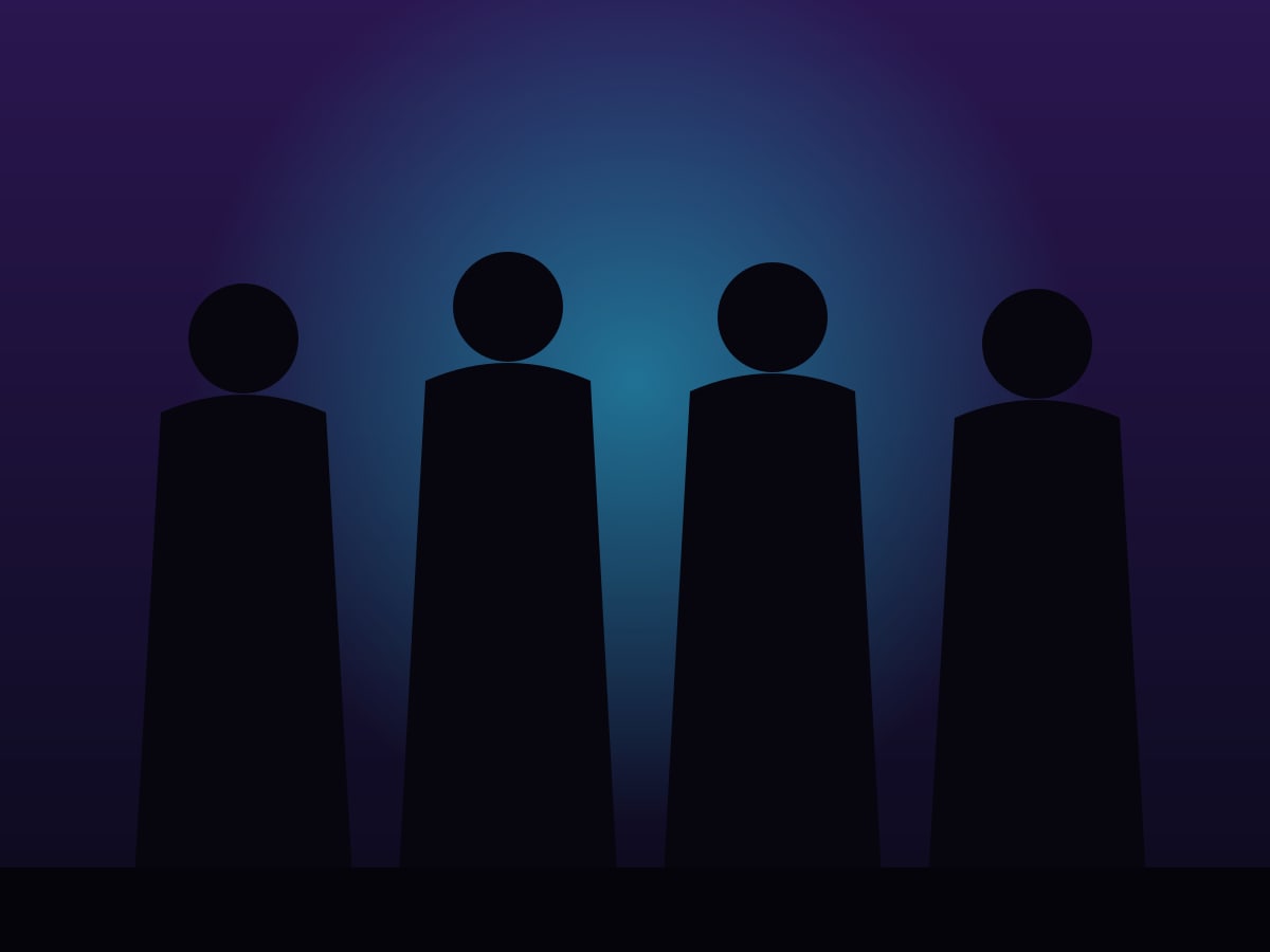 The four band members as silhouettes against a glowing backdrop