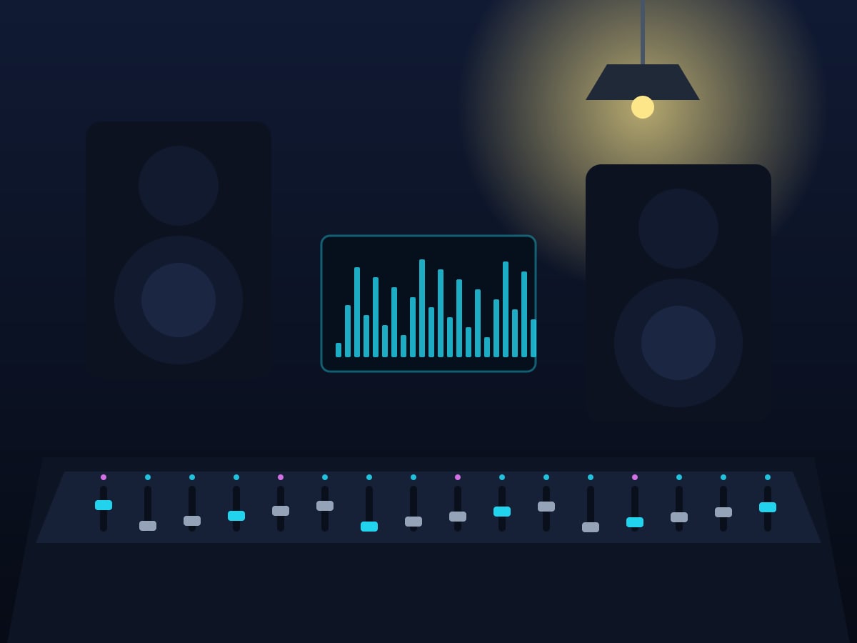 A mixing desk with glowing faders under a warm lamp
